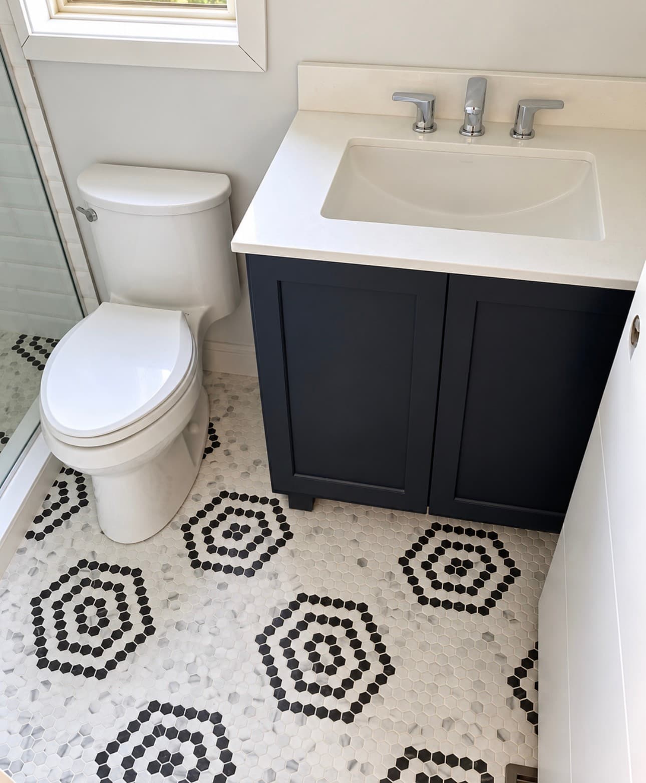 Navy Vanity & Mosaic Floor — Photo 1