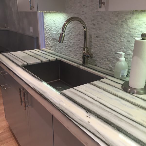 gray kitchen cabinets with striped quartz