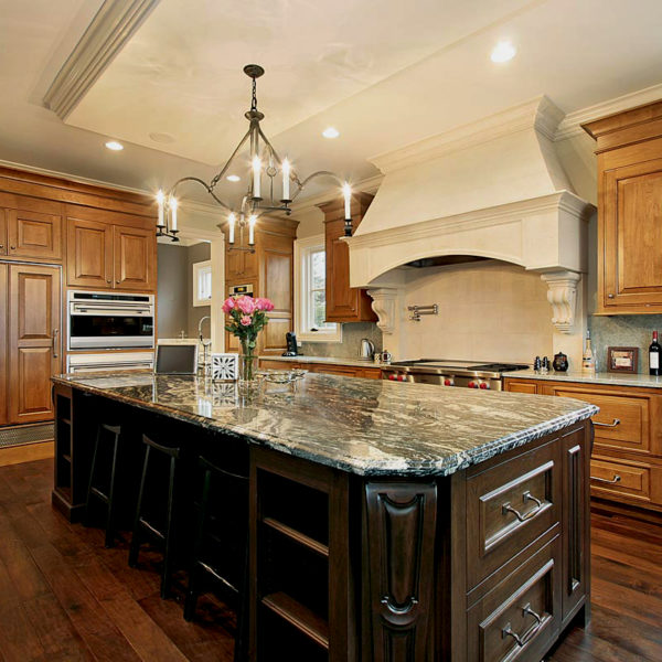 light brown kitchen cabinets with dark brown island