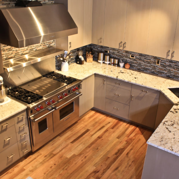 quartz with mosaic tile backsplash